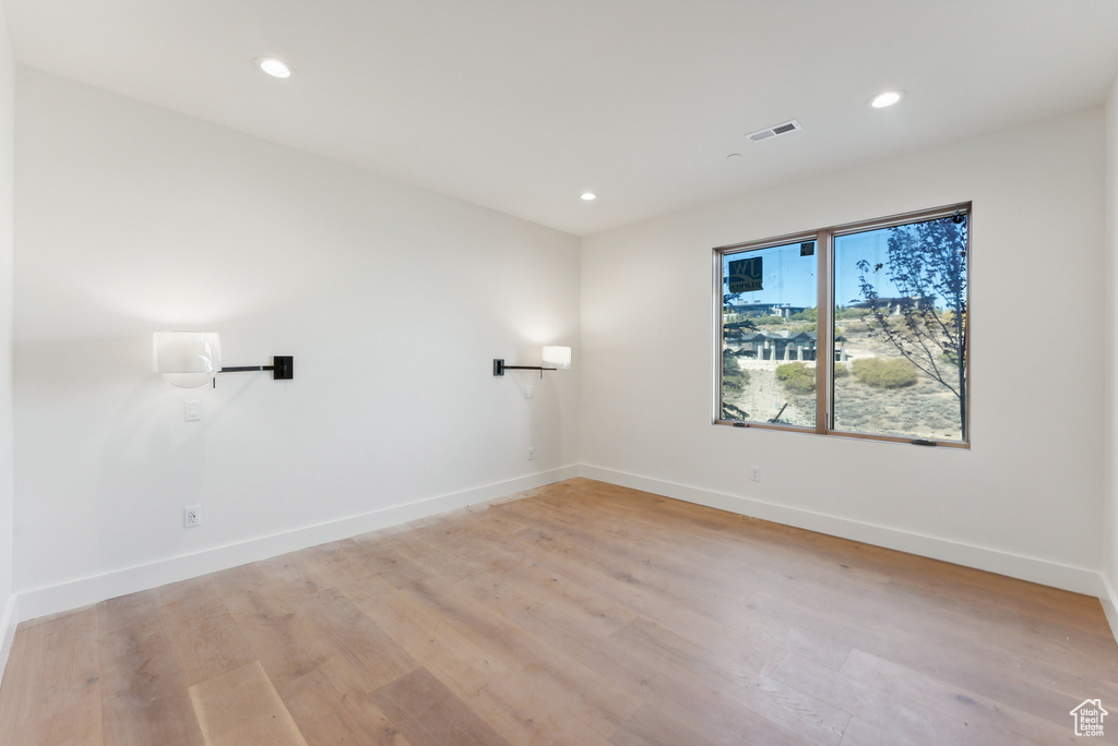 Spare room with light hardwood / wood-style flooring