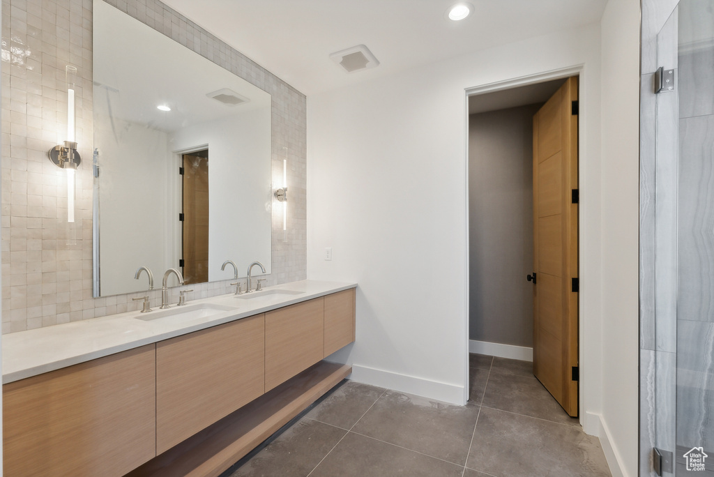 Bathroom with vanity and tile patterned floors