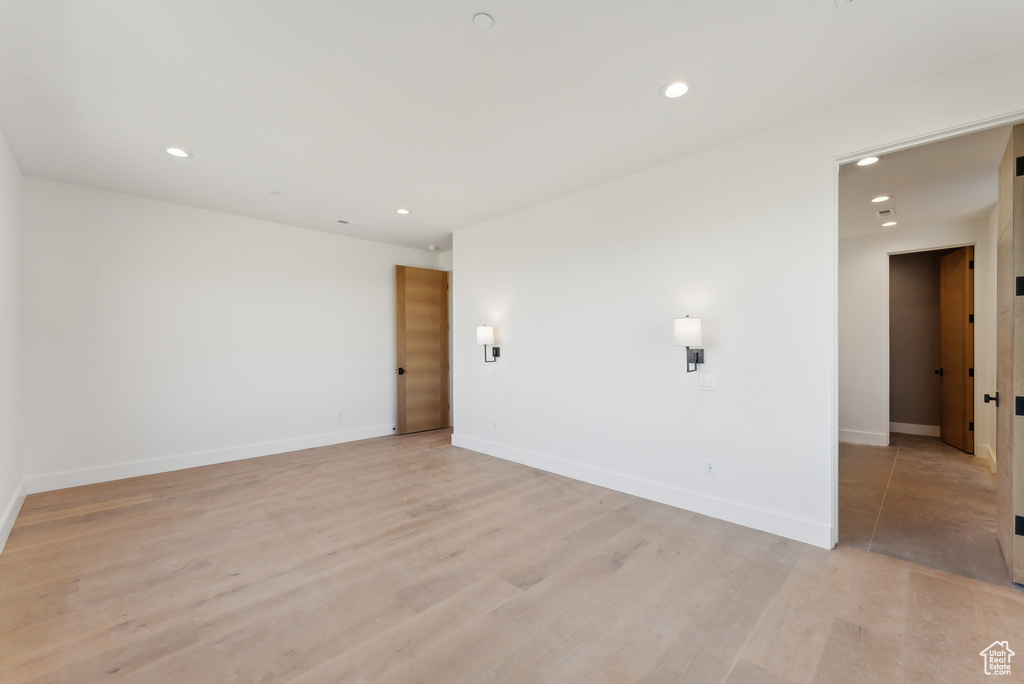 Unfurnished room with light hardwood / wood-style flooring