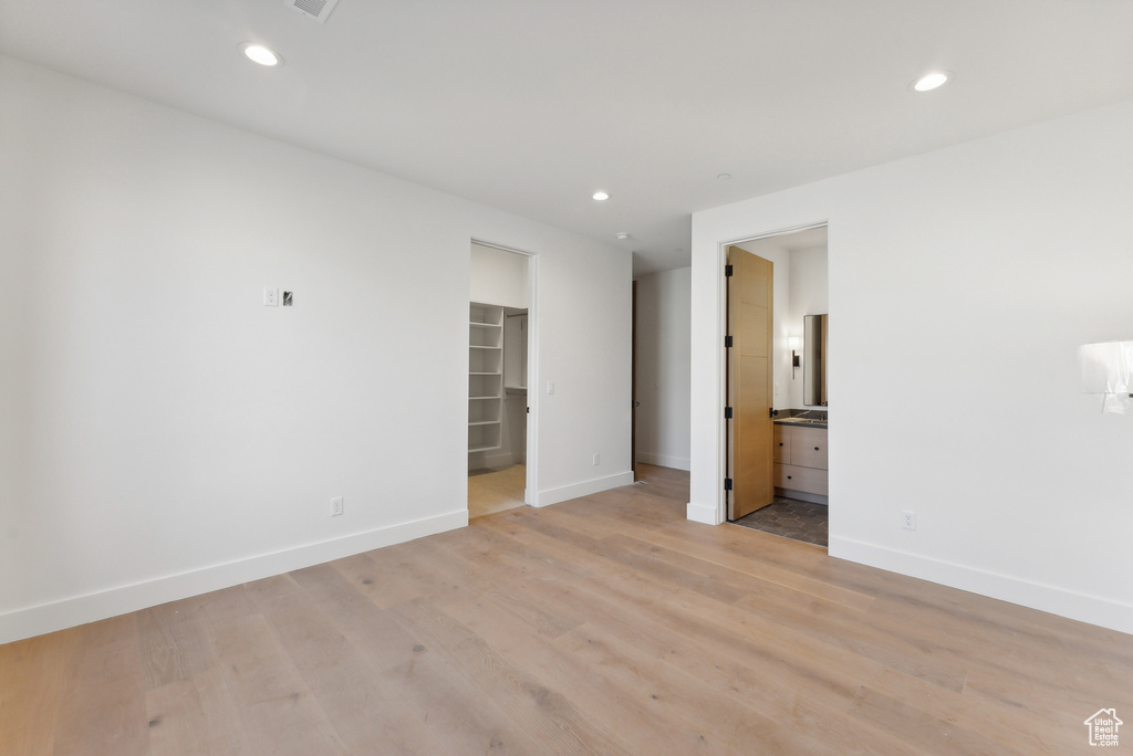 Unfurnished room with light wood-type flooring