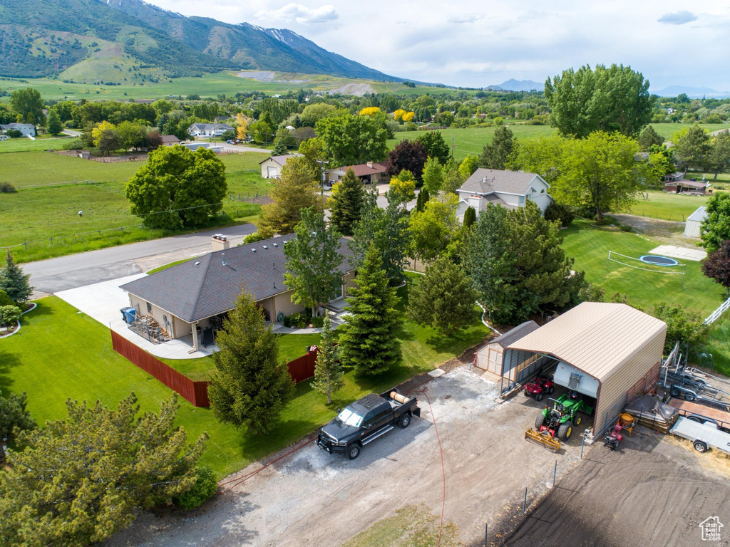 Birds eye view of property with a mountain view