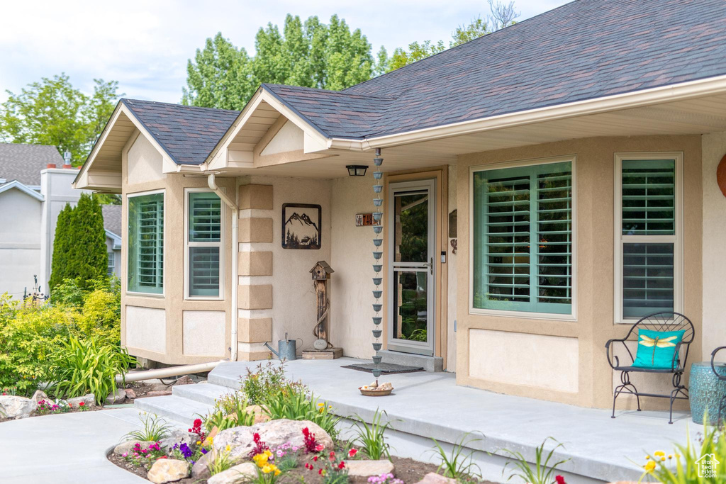 Doorway to property featuring a patio