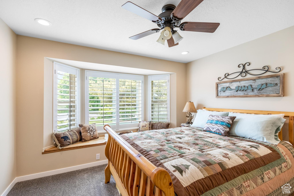 Bedroom with carpet and ceiling fan