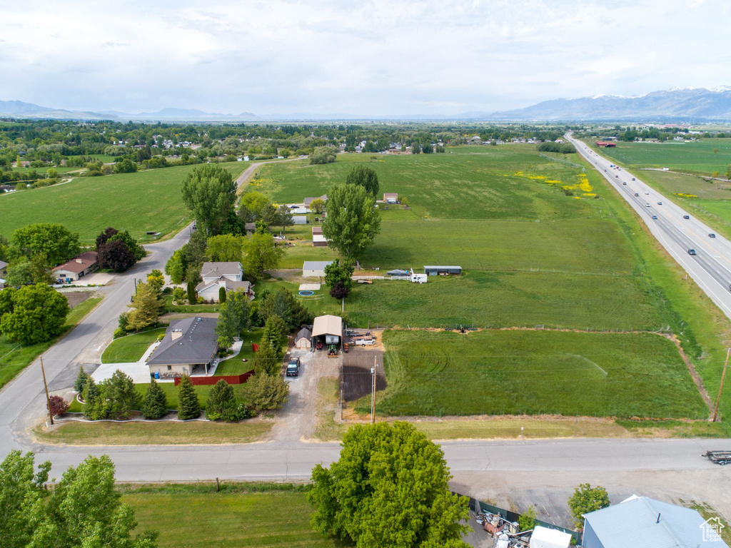 Birds eye view of property with a rural view