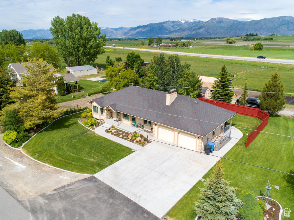 Birds eye view of property with a mountain view