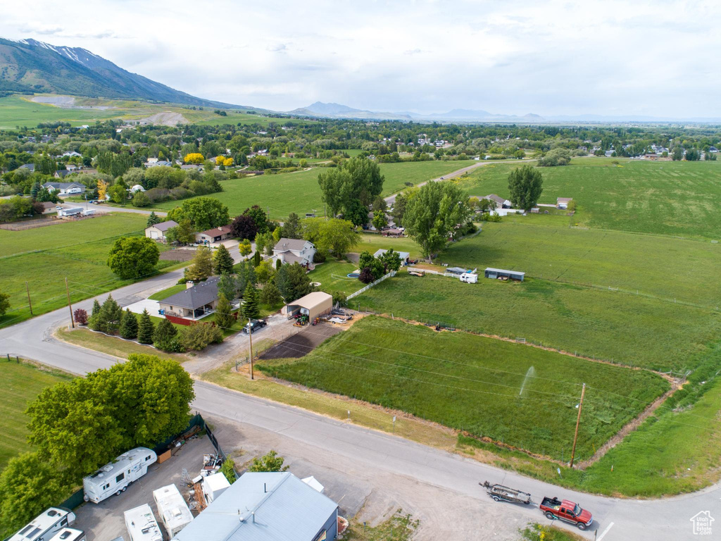 Birds eye view of property with a mountain view and a rural view