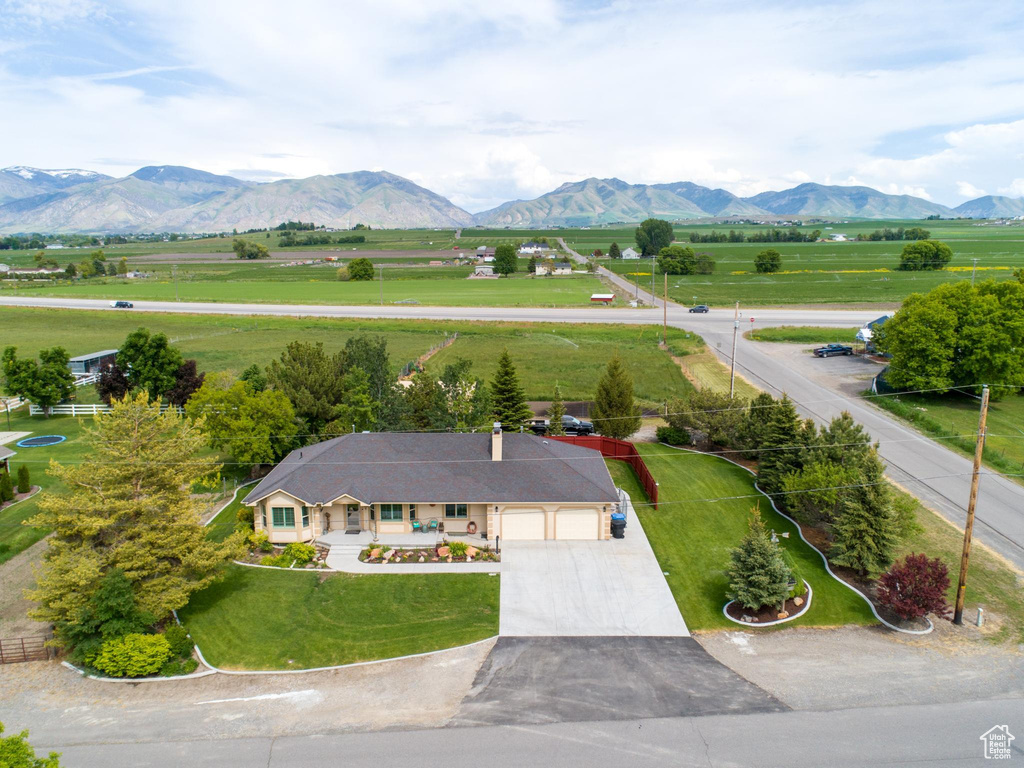 Birds eye view of property with a mountain view and a rural view