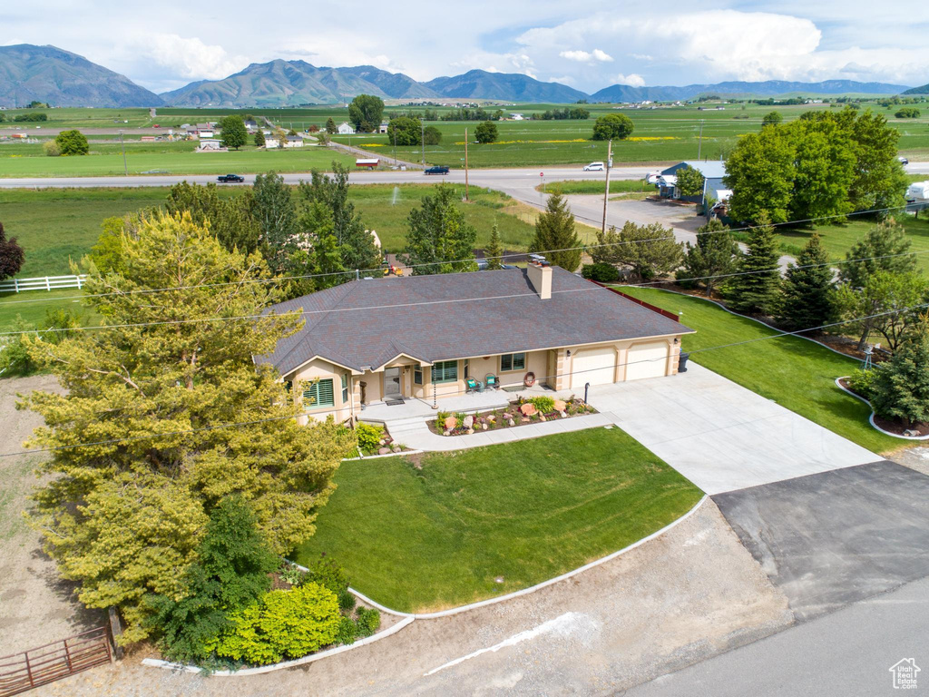 Drone / aerial view featuring a mountain view and a rural view