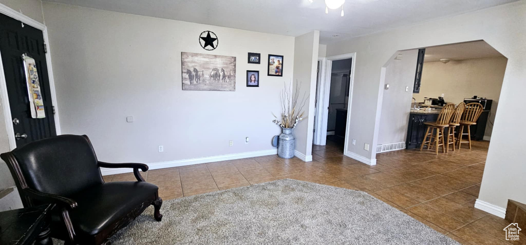 Living area with tile patterned flooring