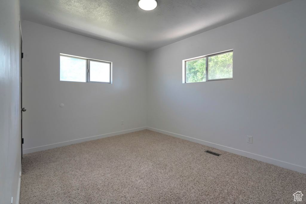 Spare room featuring carpet floors