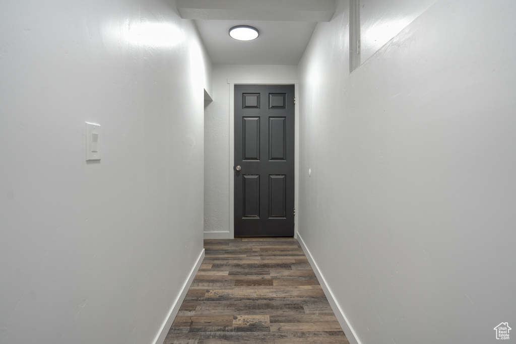 Corridor featuring dark hardwood / wood-style floors