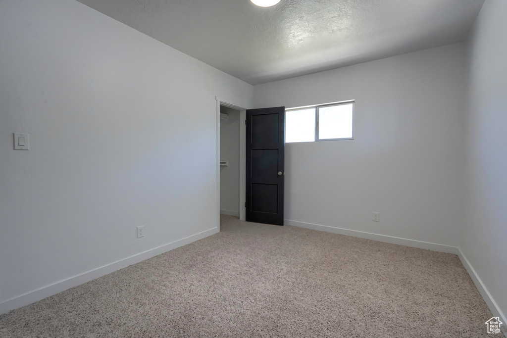 Spare room featuring carpet floors