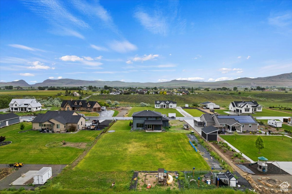 Birds eye view of property with a mountain view