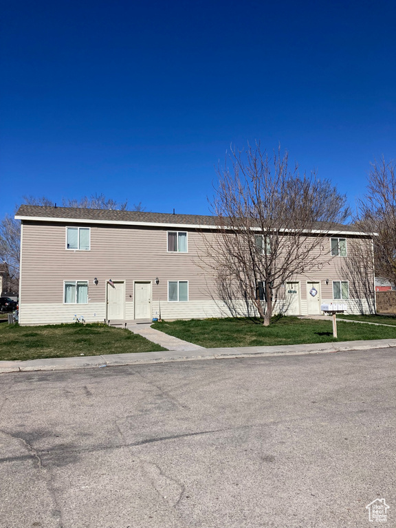 Exterior space featuring a front yard