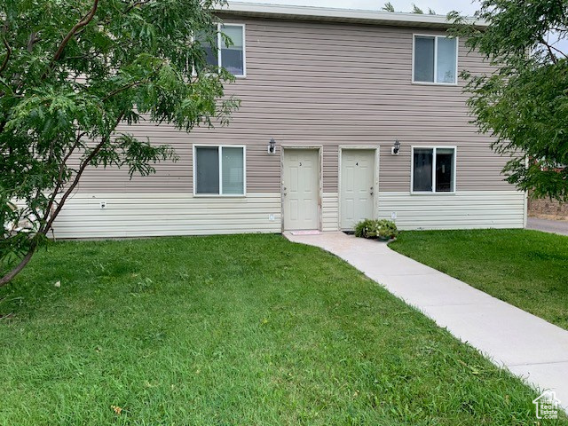 View of front of home featuring a front yard