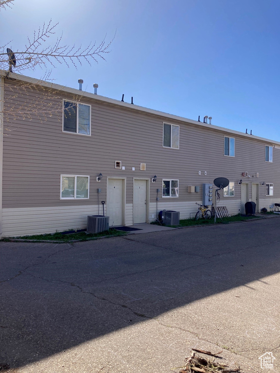 Rear view of property with central air condition unit