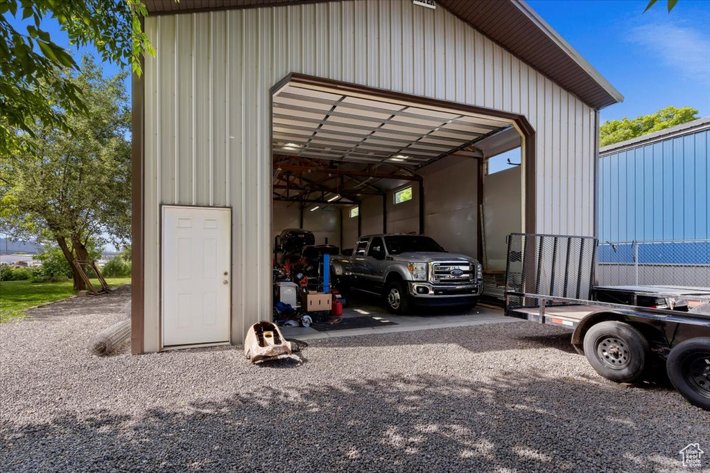 View of vehicle parking featuring a carport