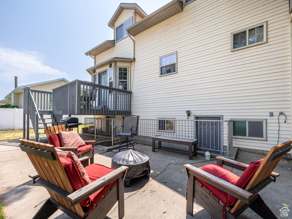 View of patio featuring an outdoor living space and a wooden deck