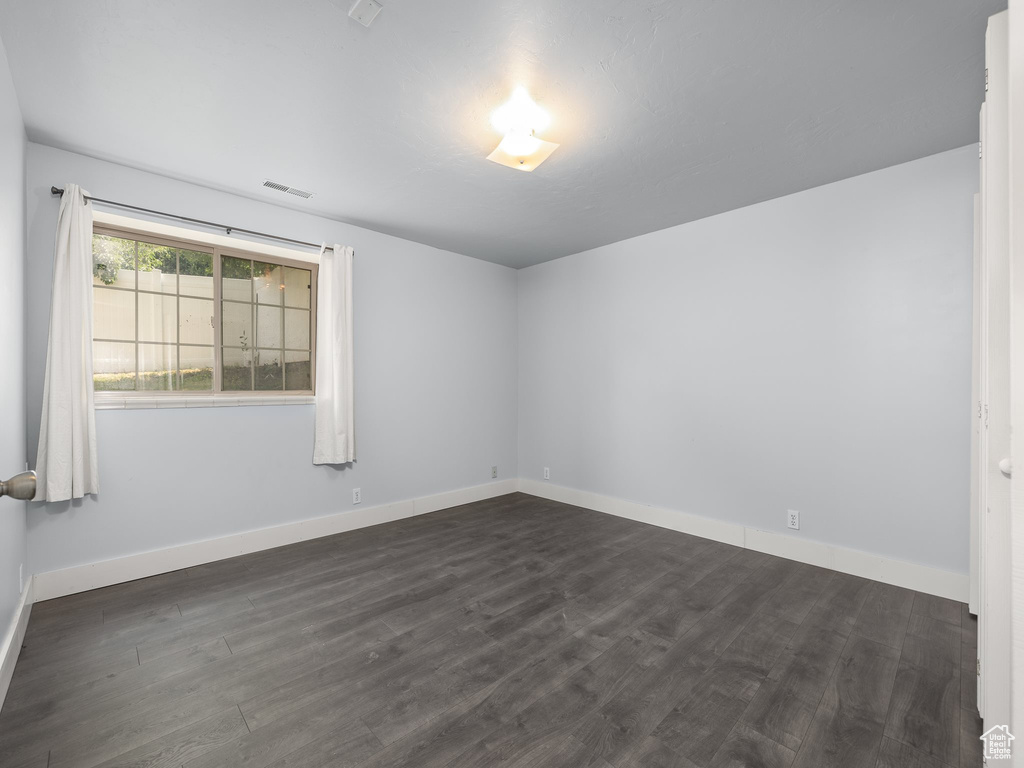 Spare room with hardwood / wood-style flooring