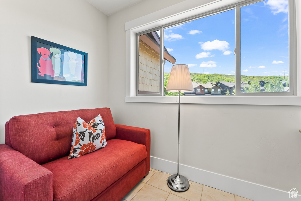 Living area featuring tile flooring