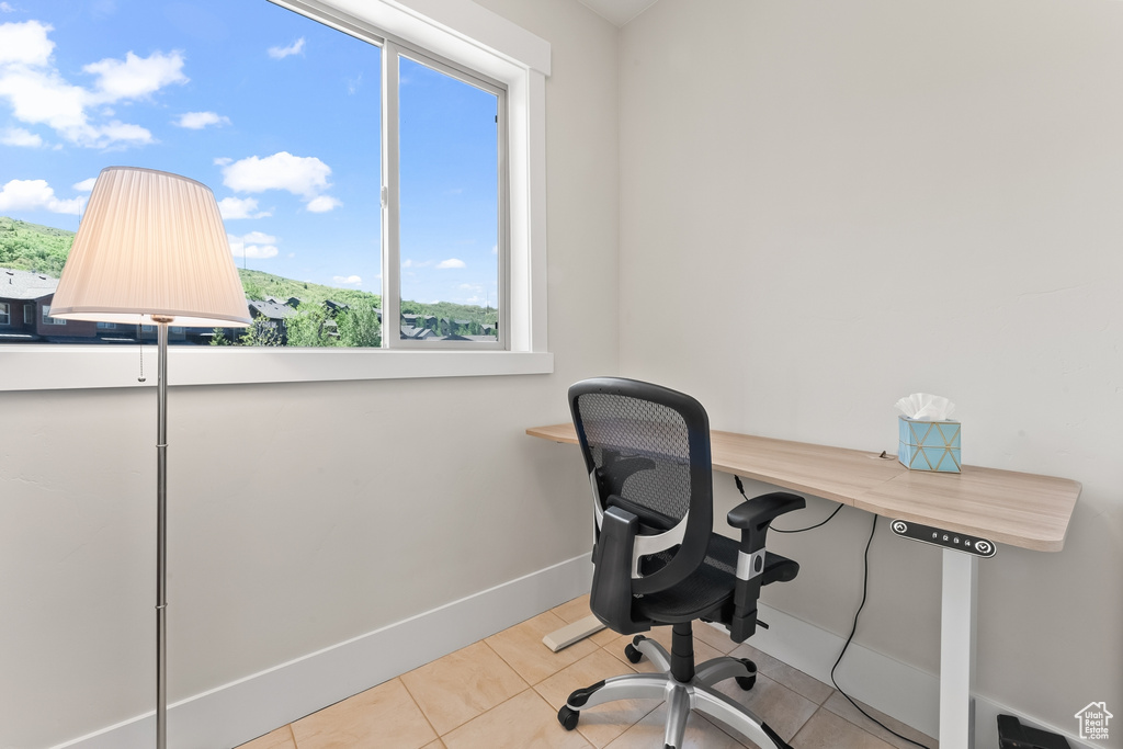 Office area featuring light tile floors