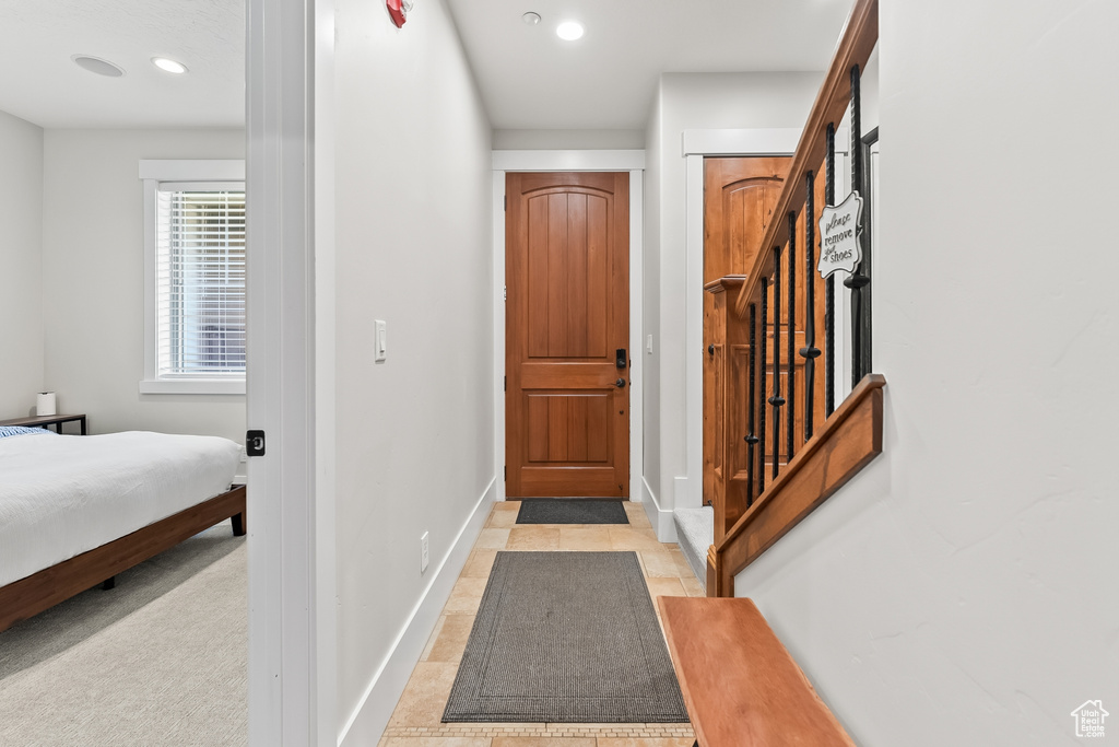 View of carpeted entrance foyer