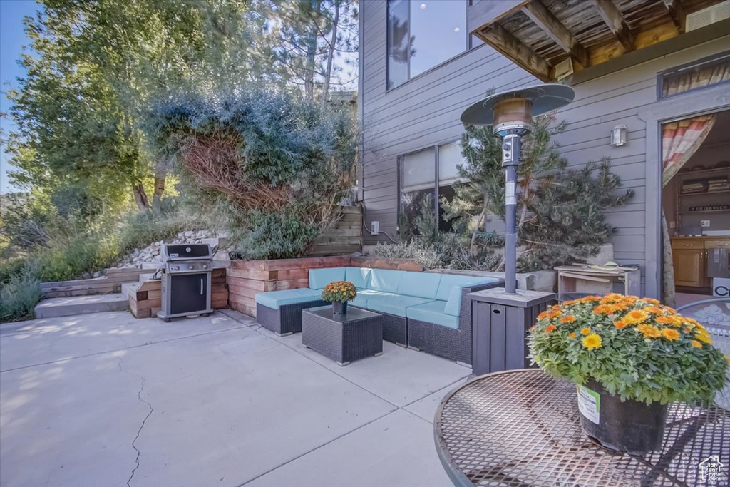 View of patio featuring outdoor lounge area and area for grilling