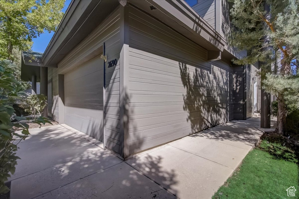 View of side of property featuring a garage