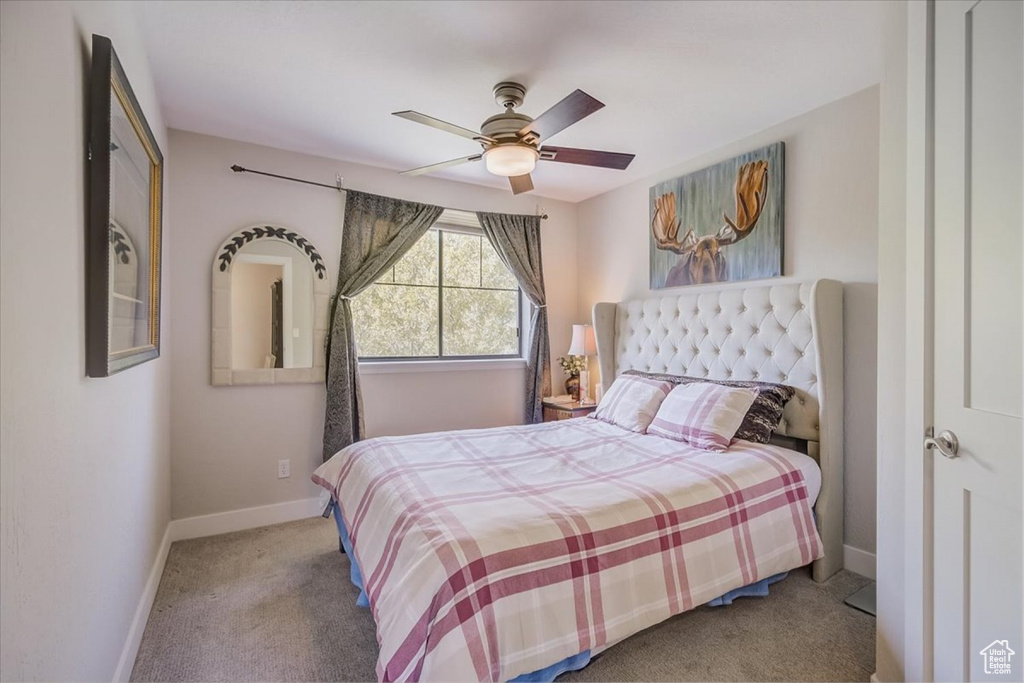 Bedroom with carpet and ceiling fan