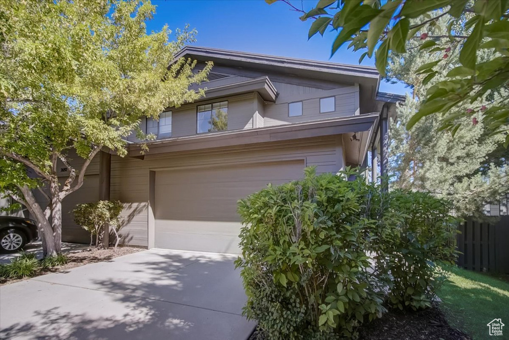 View of front of home featuring a garage