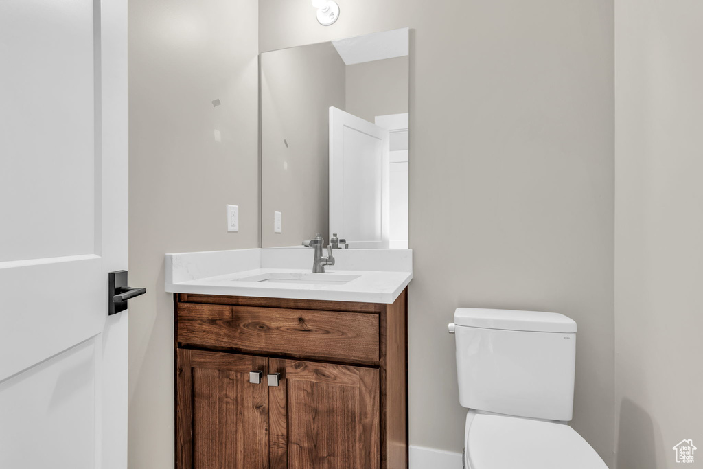 Bathroom with vanity and toilet