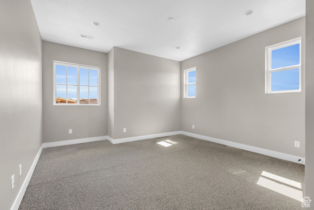 View of carpeted spare room