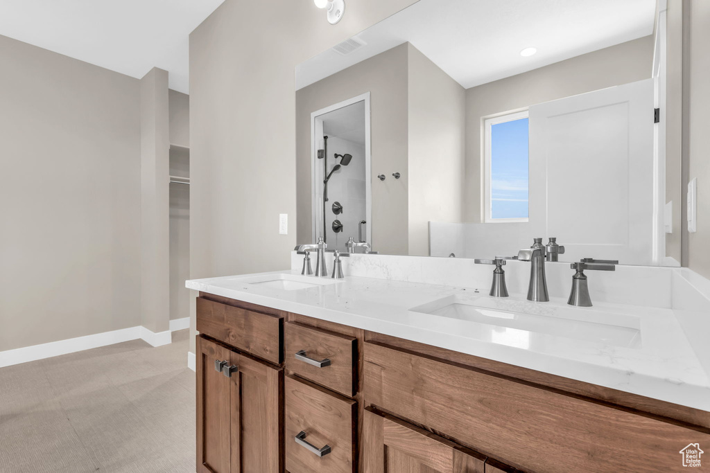 Bathroom featuring dual bowl vanity