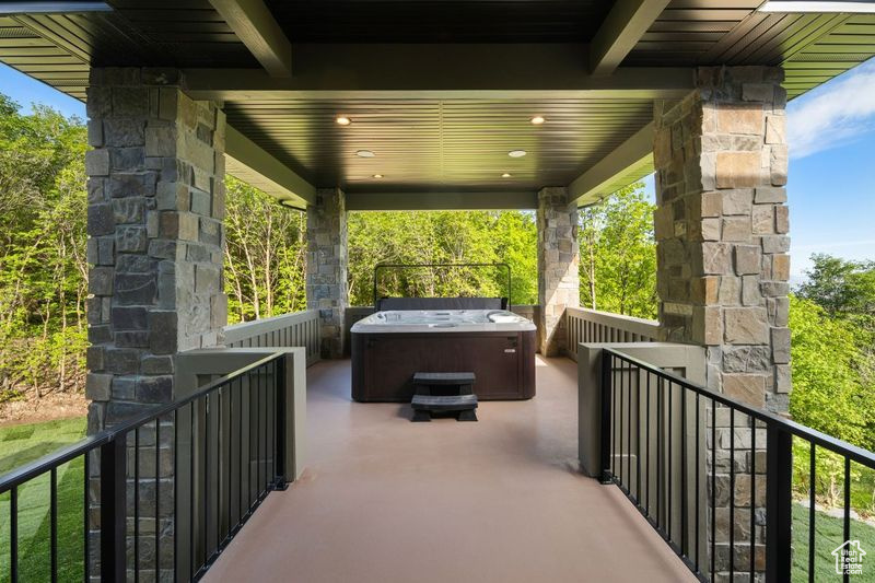 View of patio / terrace featuring a hot tub