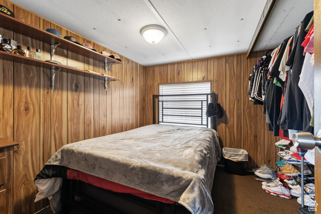 Bedroom with wooden walls