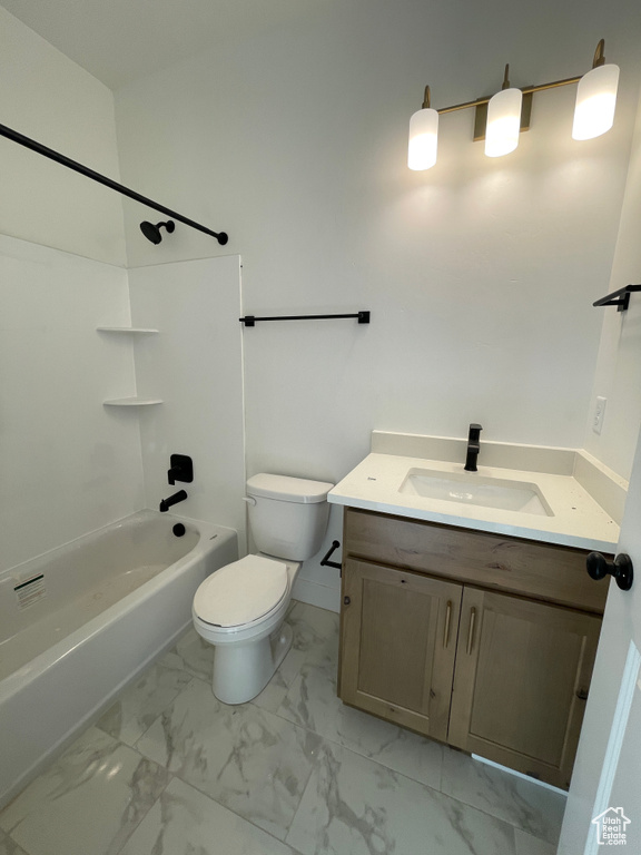 Full bathroom featuring tub / shower combination, vanity, and toilet