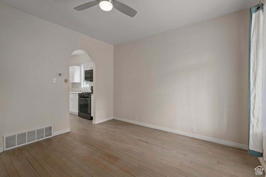 Spare room with light hardwood / wood-style flooring and ceiling fan