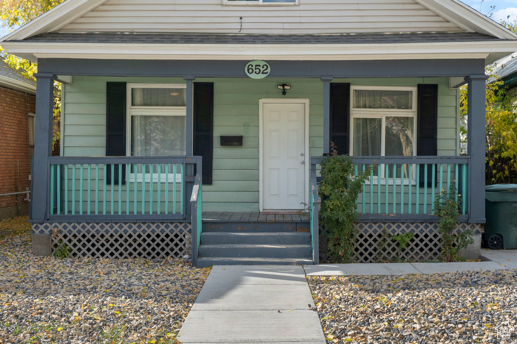 Property entrance featuring covered porch