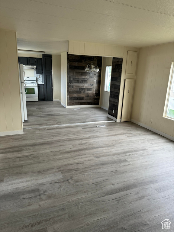 Unfurnished living room with light hardwood / wood-style floors