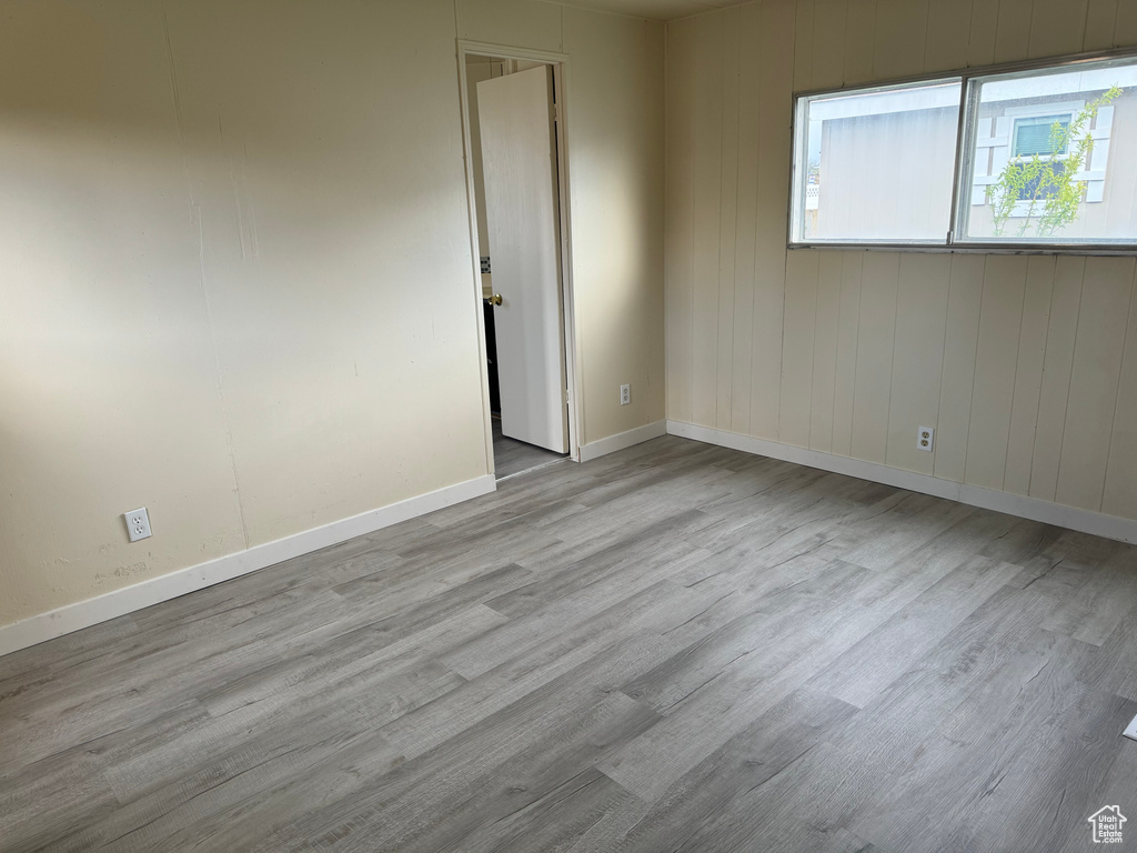 Spare room with light wood-type flooring