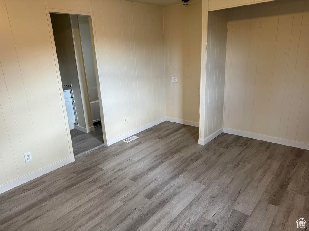 Unfurnished room featuring wood-type flooring