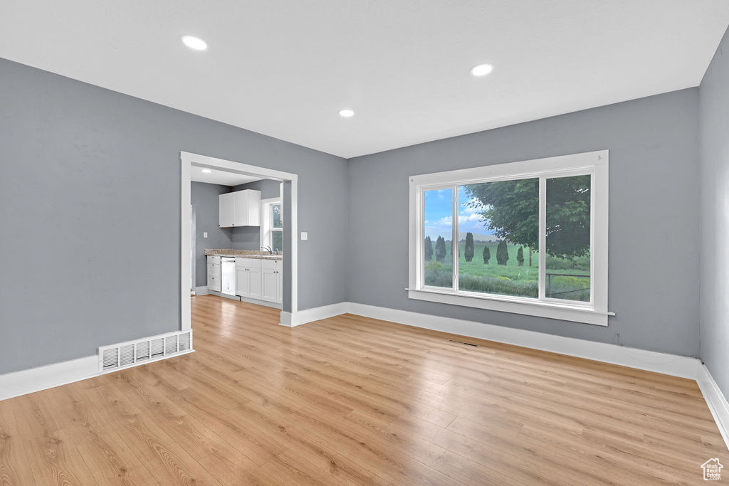 Empty room with light wood-type flooring