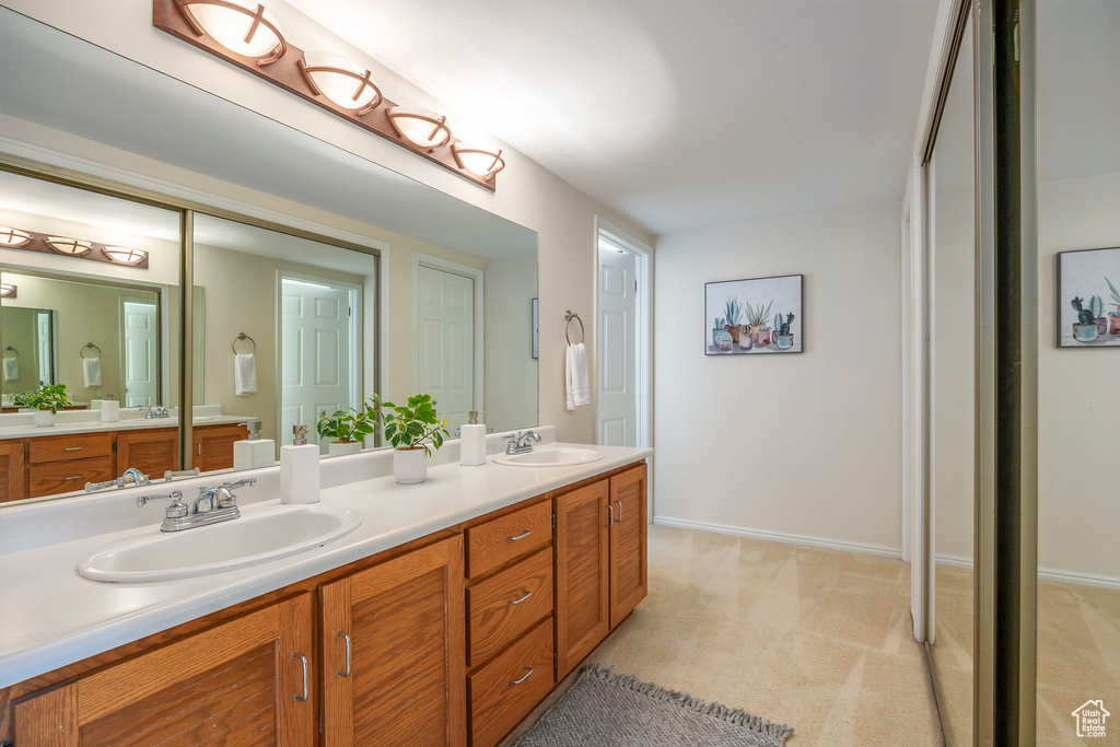 Bathroom featuring double vanity