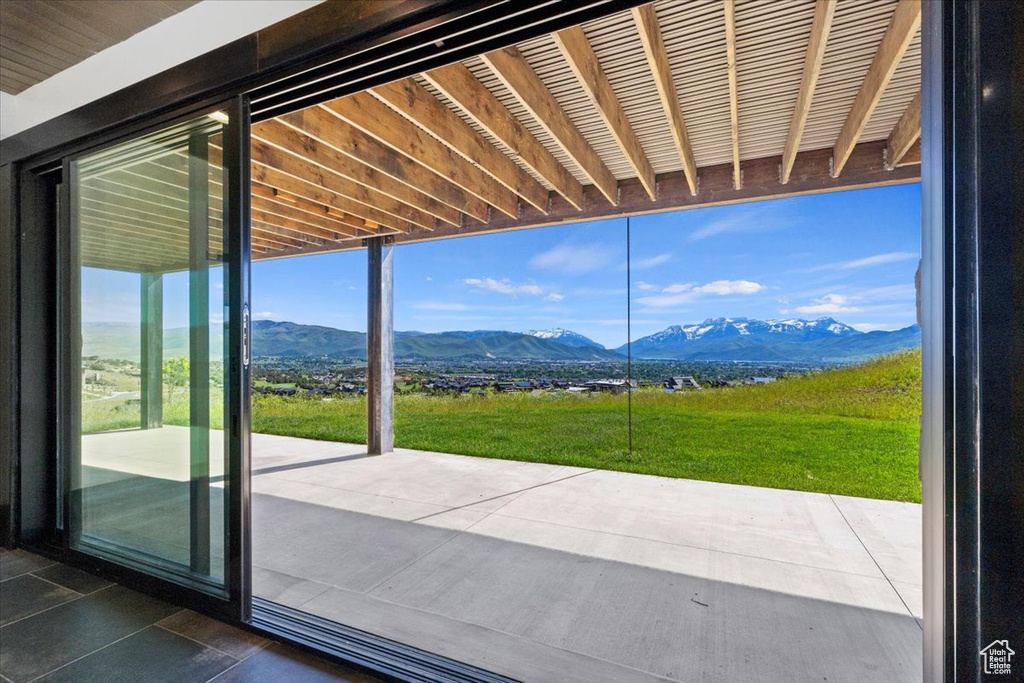 Doorway to outside with a mountain view