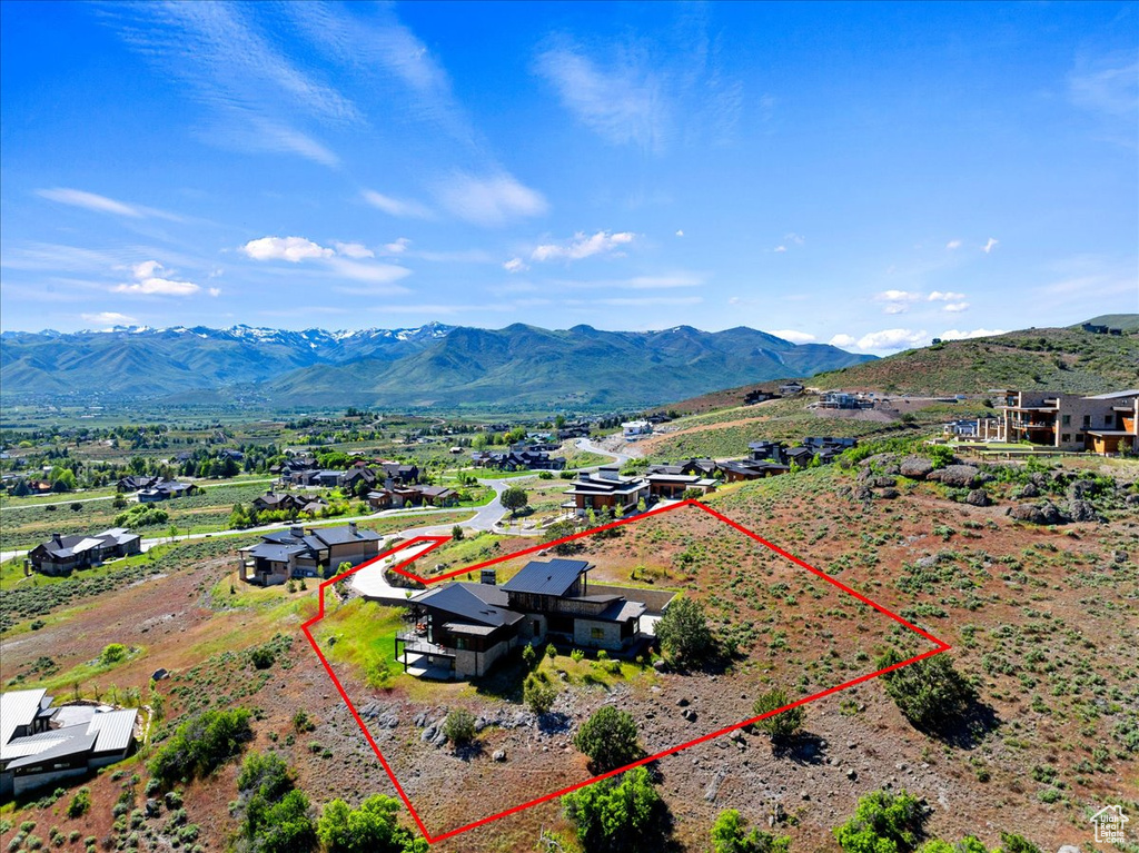 Birds eye view of property with a mountain view