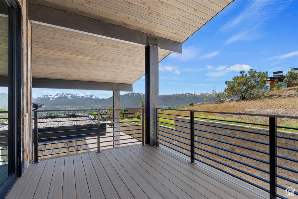 Wooden deck featuring a mountain view