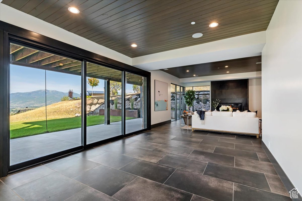 Interior space with a mountain view and tile patterned flooring