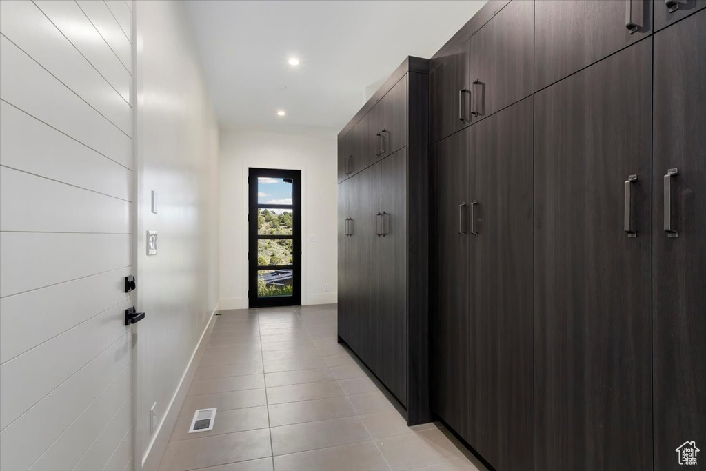 Hallway with light tile floors