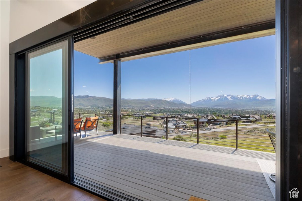 Interior space with plenty of natural light, a mountain view, and hardwood / wood-style floors