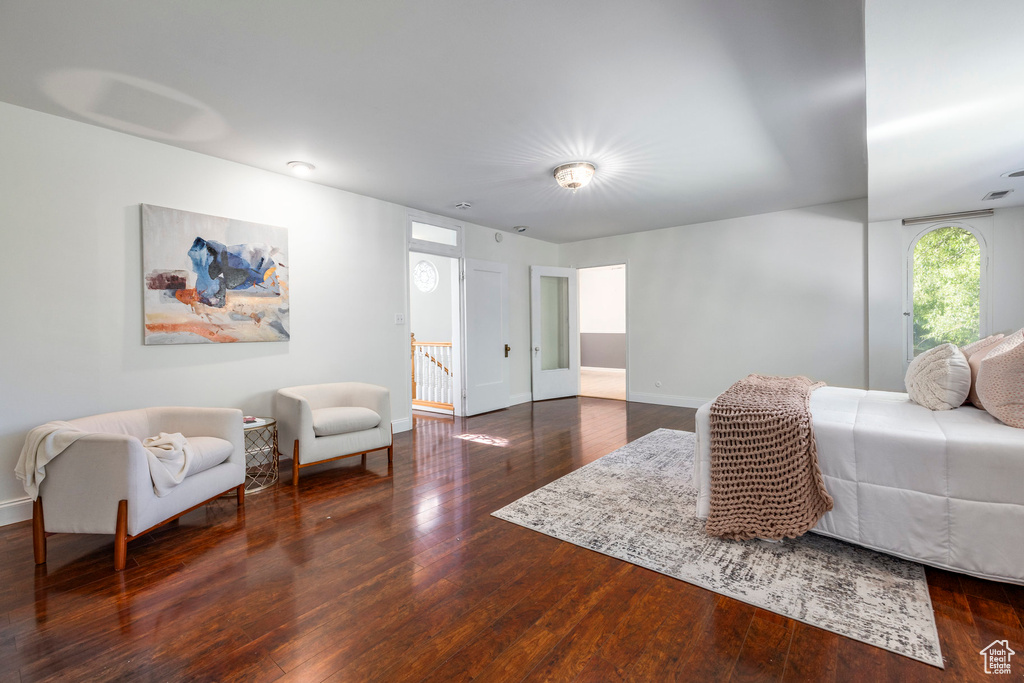 Living room with dark hardwood / wood-style flooring